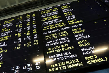 Baseball betting odds are displayed at Monmouth Park Sports Book by William Hill, on the opening of the first day of legal betting on sports in Oceanport